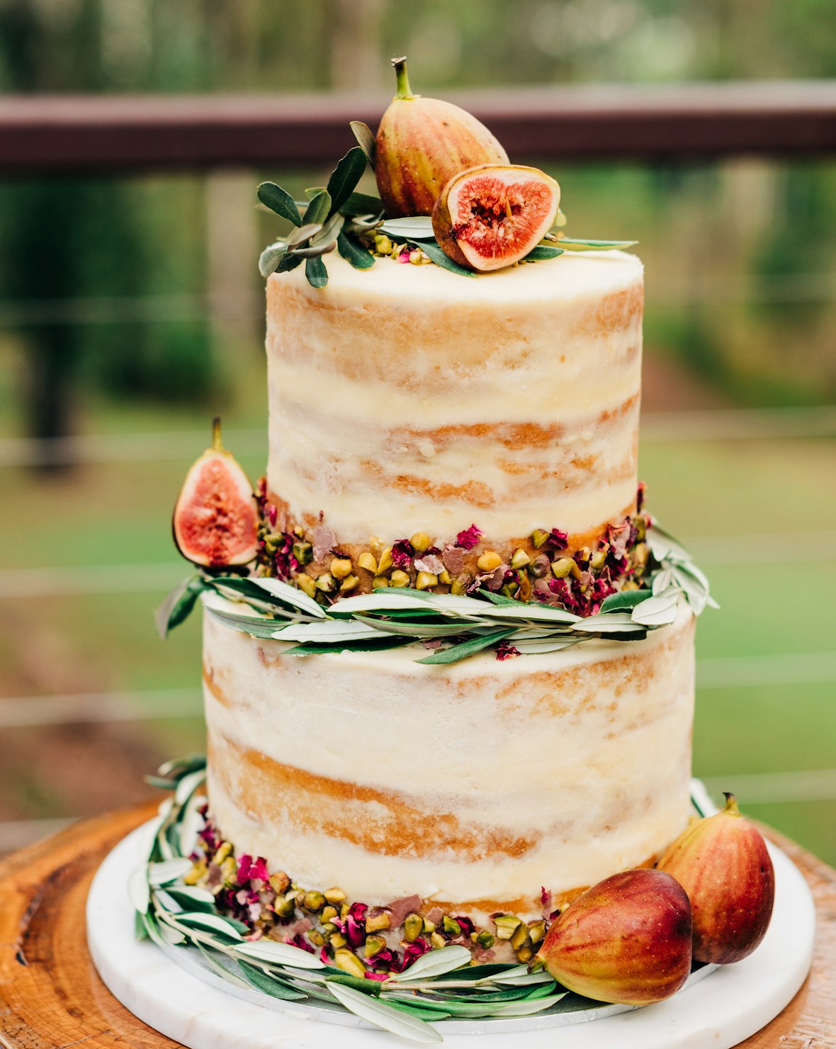 A wedding cake finished with fresh seasonal florals