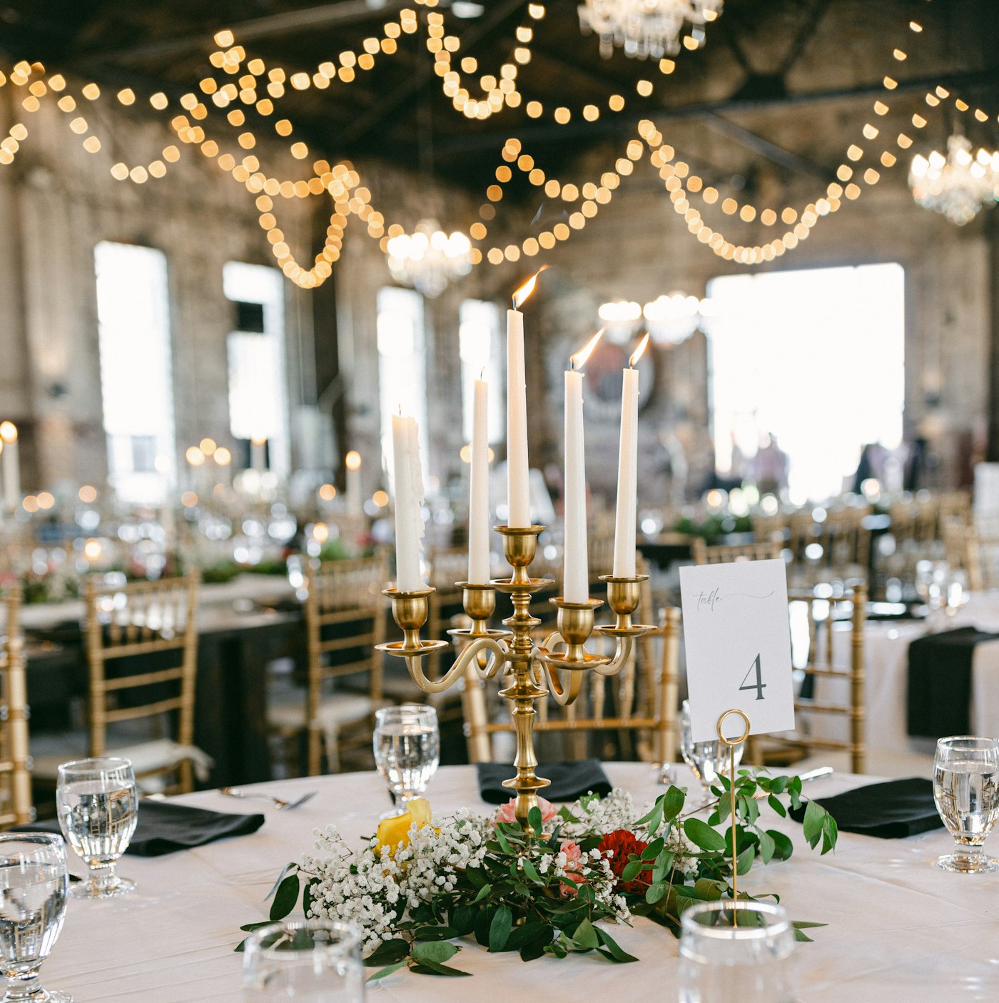 A reception lit by chandeliers