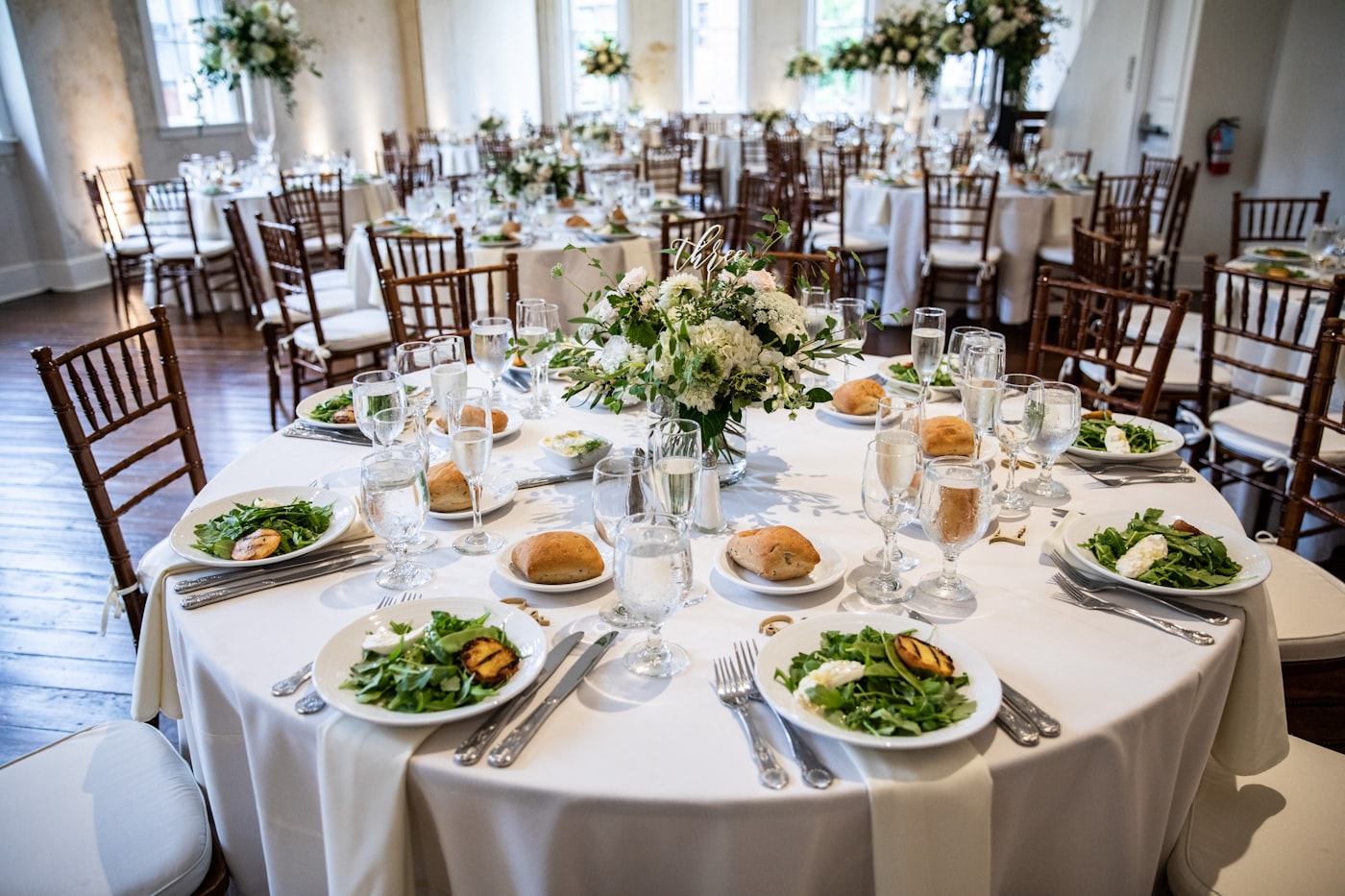 A warm candlelit reception table