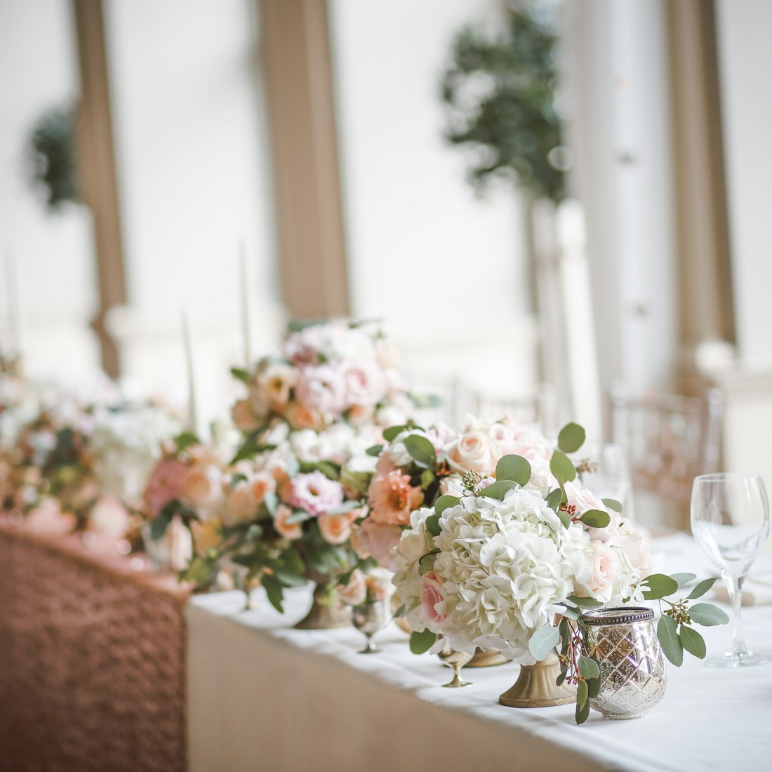 Lush wedding florals styled by the planning team